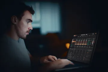 A cheerful woman in traditional clothing using her smartphone during a festive moment, showing how easily the 366BET app fits into everyday life.